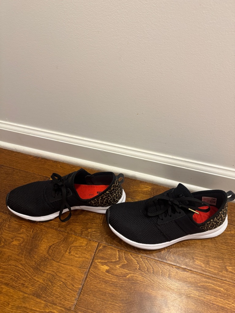 New Balance Black Athletic Sneakers with Leopard-Print Heel Accent